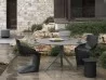 Oops table by Kristalia in an outdoor area