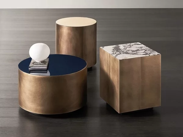 Different sizes and finishes for the Belt side table by Meridiani