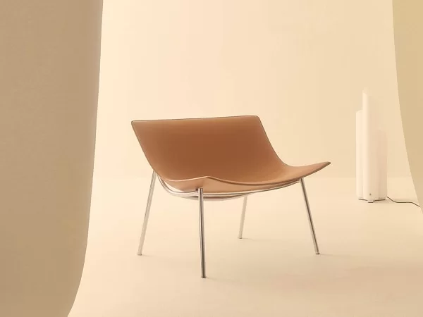 Omega armchair by Lema in a living area