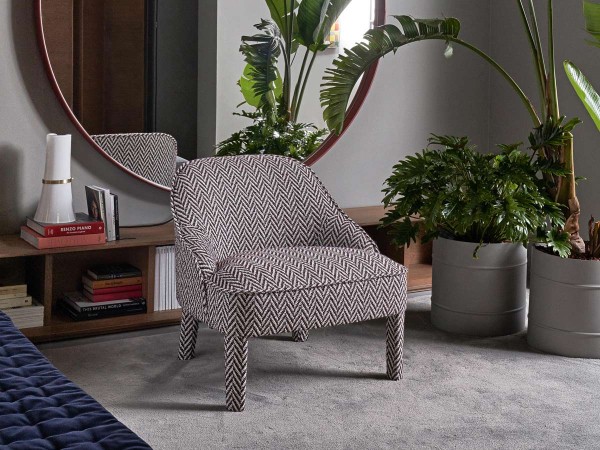 The Ida armchair by Meridiani in a living area